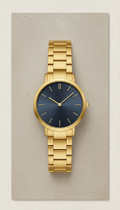 Reloj minimalista de oro cepillado
